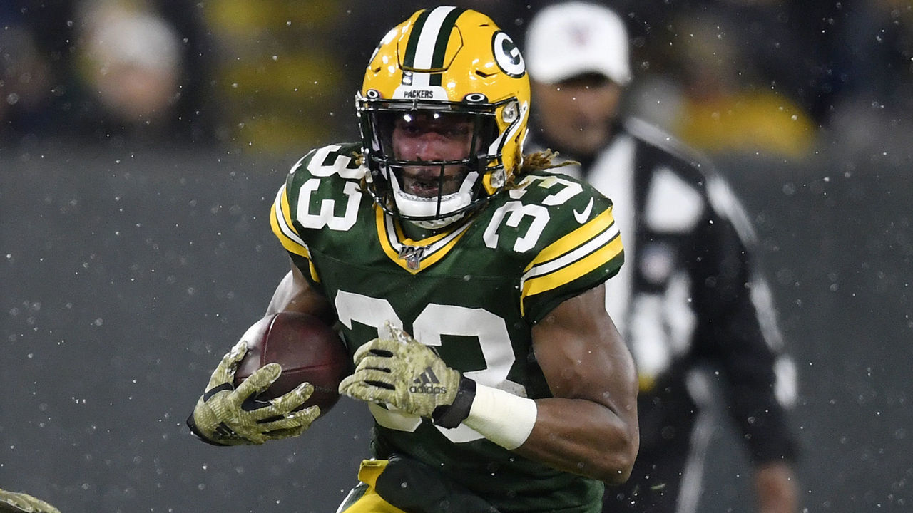 GREEN BAY, WISCONSIN - NOVEMBER 10: Aaron Jones #33 of the Green Bay Packers runs with the football in the second half against the Carolina Panthers at Lambeau Field on November 10, 2019 in Green Bay, Wisconsin.