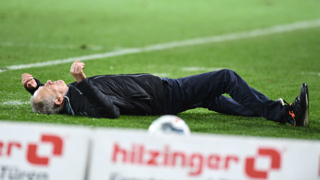 FREIBURG IM BREISGAU, GERMANY - NOVEMBER 10: Headcoach Christian Streich of SC Freiburg lying on pitch after a check during the Bundesliga match between Sport-Club Freiburg and Eintracht Frankfurt at Schwarzwald-Stadion on November 10, 2019 in Freiburg im Breisgau, Germany.