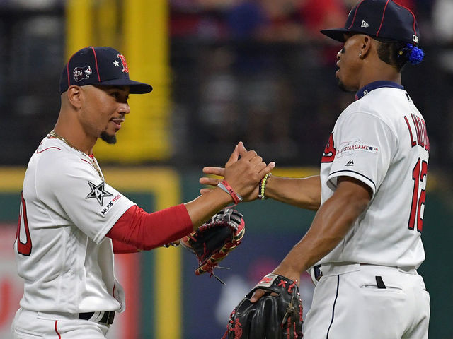 CLEVELAND, OHIO - JULY 09: Francisco Lindor #12 of the Cleveland Indians and Mookie Betts #50 of the Boston Red Sox participate in the 2019 MLB All-Star Game at Progressive Field on July 09, 2019 in Cleveland, Ohio.
