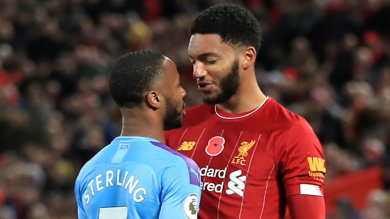 Liverpool's Joe Gomez (right) and Manchester City's Raheem Sterling clash during the Premier League match at Anfield, Liverpool.