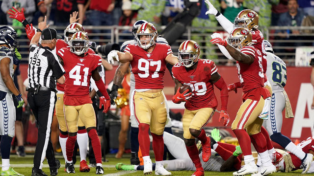 SANTA CLARA, CALIFORNIA - NOVEMBER 11: Strong safety Jaquiski Tartt #29 and defensive end Nick Bosa #97 of the San Francisco 49ers look to the official after Tartt strips the ball from wide receiver D.K. Metcalf #14 of the Seattle Seahawks at the two yard line to prevent a Seattle Seahawks touchdown in the second quarter at Levi's Stadium on November 11, 2019 in Santa Clara, California.