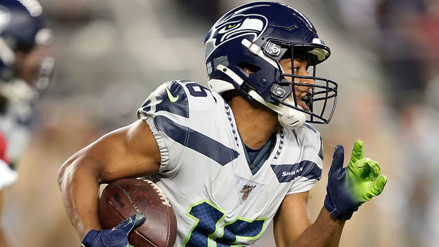 SANTA CLARA, CALIFORNIA - NOVEMBER 11: Wide receiver Tyler Lockett #16 of the Seattle Seahawks carries the ball against the defnse of the San Francisco 49ers in the game at Levi's Stadium on November 11, 2019 in Santa Clara, California.