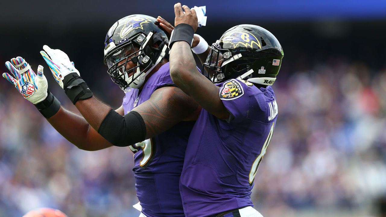 BALTIMORE, MD - OCTOBER 13: Lamar Jackson #8 celebrates his touchdown against the Cincinnati Bengals with Ronnie Stanley #79 of the Baltimore Ravens during the first half at M&T Bank Stadium on October 13, 2019 in Baltimore, Maryland.