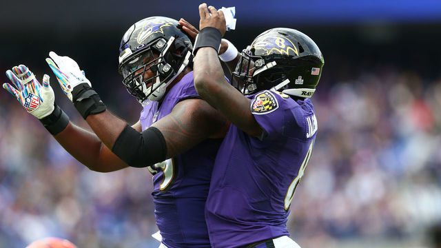 BALTIMORE, MD - OCTOBER 13: Lamar Jackson #8 celebrates his touchdown against the Cincinnati Bengals with Ronnie Stanley #79 of the Baltimore Ravens during the first half at M&T Bank Stadium on October 13, 2019 in Baltimore, Maryland.