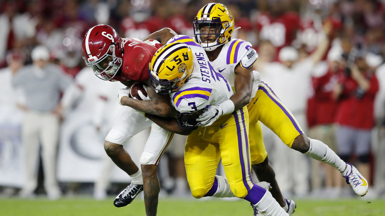 TUSCALOOSA, ALABAMA - NOVEMBER 09: DeVonta Smith #6 of the Alabama Crimson Tide is tackled by JaCoby Stevens #3 and Marcel Brooks #9 of the LSU Tigers during the second half in the game at Bryant-Denny Stadium on November 09, 2019 in Tuscaloosa, Alabama.