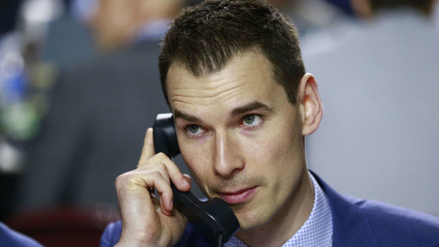 VANCOUVER, BRITISH COLUMBIA - JUNE 22: General manager John Chayka of the Arizona Coyotes talks on the phone during Rounds 2-7 of the 2019 NHL Draft at Rogers Arena on June 22, 2019 in Vancouver, Canada.