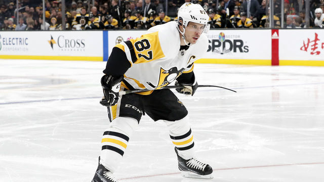 BOSTON, MA - NOVEMBER 04: Pittsburgh Penguins center Sidney Crosby (87) waits to move in for the draw during a game between the Boston Bruins and the Pittsburgh Penguins on November 4, 2019, at TD Garden in Boston, Massachusetts.