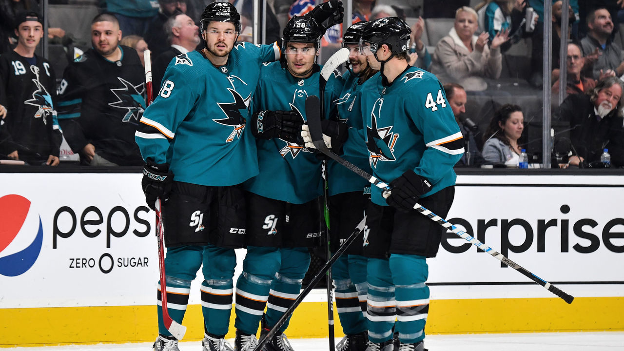 SAN JOSE, CA - NOVEMBER 12: Timo Meier #28, Tomas Hertl #48, Erik Karlsson #65 and Marc-Edouard Vlasic #44 of the San Jose Sharks celebrate scoring a goal against the Edmonton Oilers at SAP Center on November 12, 2019 in San Jose, California.