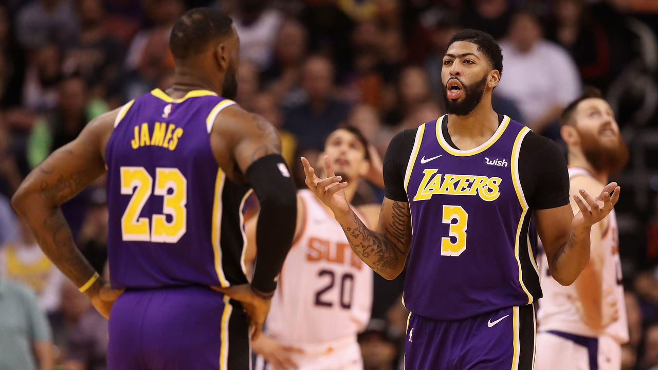 PHOENIX, ARIZONA - NOVEMBER 12: Anthony Davis #3 of the Los Angeles Lakers talks with LeBron James #23 during the second half of the NBA game against the Phoenix Suns at Talking Stick Resort Arena on November 12, 2019 in Phoenix, Arizona. The Lakers defeated the Suns 123-115. NOTE TO USER: User expressly acknowledges and agrees that, by downloading and/or using this photograph, user is consenting to the terms and conditions of the Getty Images License Agreement