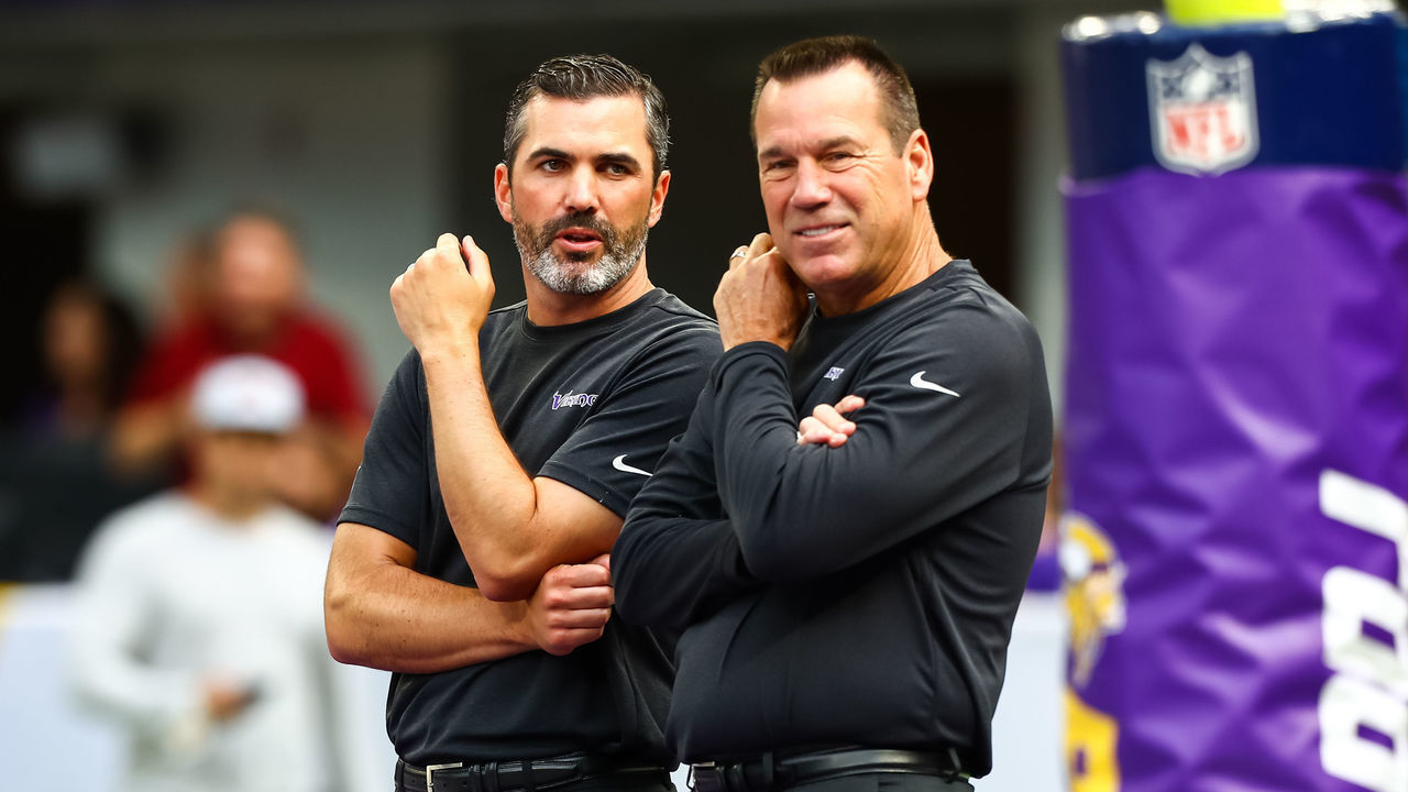 MINNEAPOLIS, MN - AUGUST 24: Minnesota Vikings offensive coordinator Kevin Stefanski and assistant head coach Gary Kubiak talk before the start of a preseason game against the Arizona Cardinals at U.S. Bank Stadium on August 24, 2019 in Minneapolis, Minnesota.