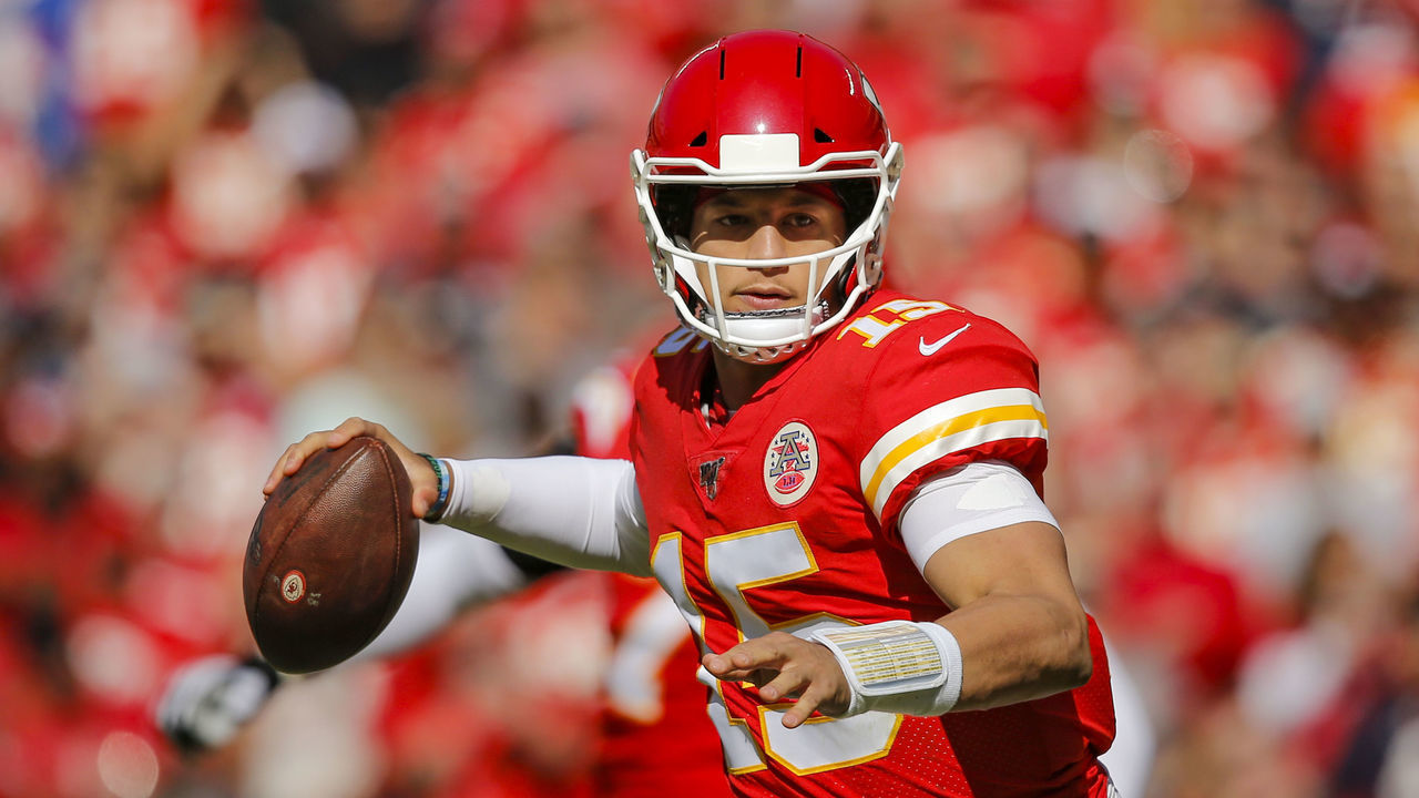 KANSAS CITY, MO - OCTOBER 13: Patrick Mahomes #15 of the Kansas City Chiefs throws a six-yard touchdown pass in the third quarter against the Houston Texans at Arrowhead Stadium on October 13, 2019 in Kansas City, Missouri.