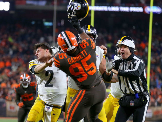 CLEVELAND, OH - NOVEMBER 14: Cleveland Browns defensive end Myles Garrett (95) swings at Pittsburgh Steelers quarterback Mason Rudolph (2) with Rudolphs own helmet with 0:08 seconds left in the fourth quarter of the National Football League game between the Pittsburgh Steelers and Cleveland Browns on November 14, 2019, at FirstEnergy Stadium in Cleveland, OH.