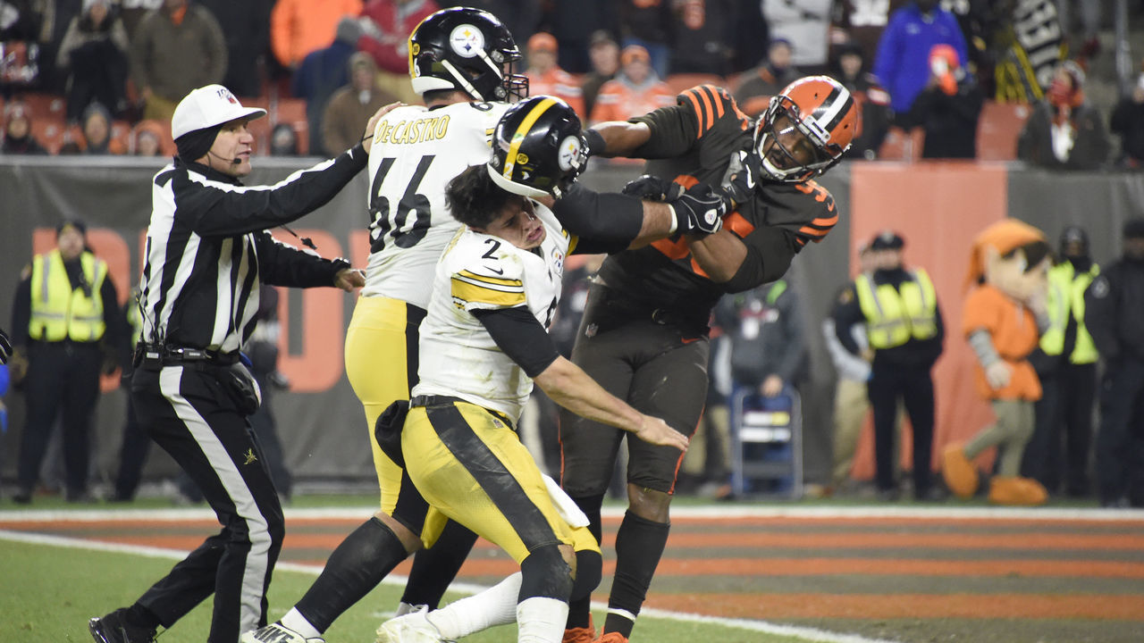 CLEVELAND, OHIO - NOVEMBER 14: Quarterback Mason Rudolph #2 of the Pittsburgh Steelers fights with defensive end Myles Garrett #95 of the Cleveland Browns during the second half at FirstEnergy Stadium on November 14, 2019 in Cleveland, Ohio. The Browns defeated the Steelers 21-7.