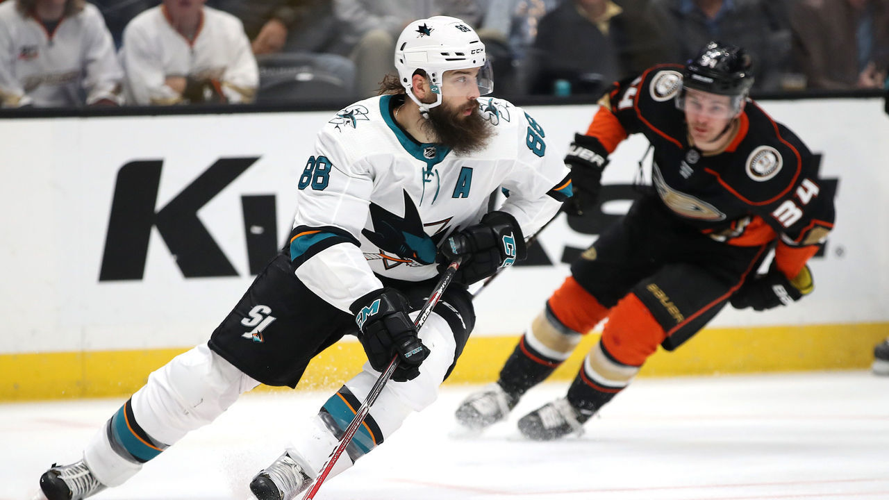 ANAHEIM, CALIFORNIA - NOVEMBER 14: Brent Burns #88 of the San Jose Sharks controls the puck past Sam Steel #34 of the Anaheim Ducks during the first period of a game at Honda Center on November 14, 2019 in Anaheim, California.