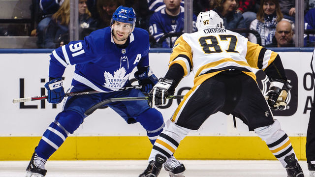 TORONTO, ON - FEBRUARY 2: John Tavares #91 of the Toronto Maple Leafs takes a face offa agains Sidney Crosby #87 of the Pittsburgh Penguins during the first period at the Scotiabank Arena on February 2, 2018 in Toronto, Ontario, Canada.