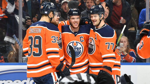 EDMONTON, AB - NOVEMBER 14: Connor McDavid #97, Oscar Klefbom #77 and Alex Chiasson #39 of the Edmonton Oilers celebrate after a goal during the game against the Colorado Avalanche on November 14, 2019, at Rogers Place in Edmonton, Alberta, Canada.