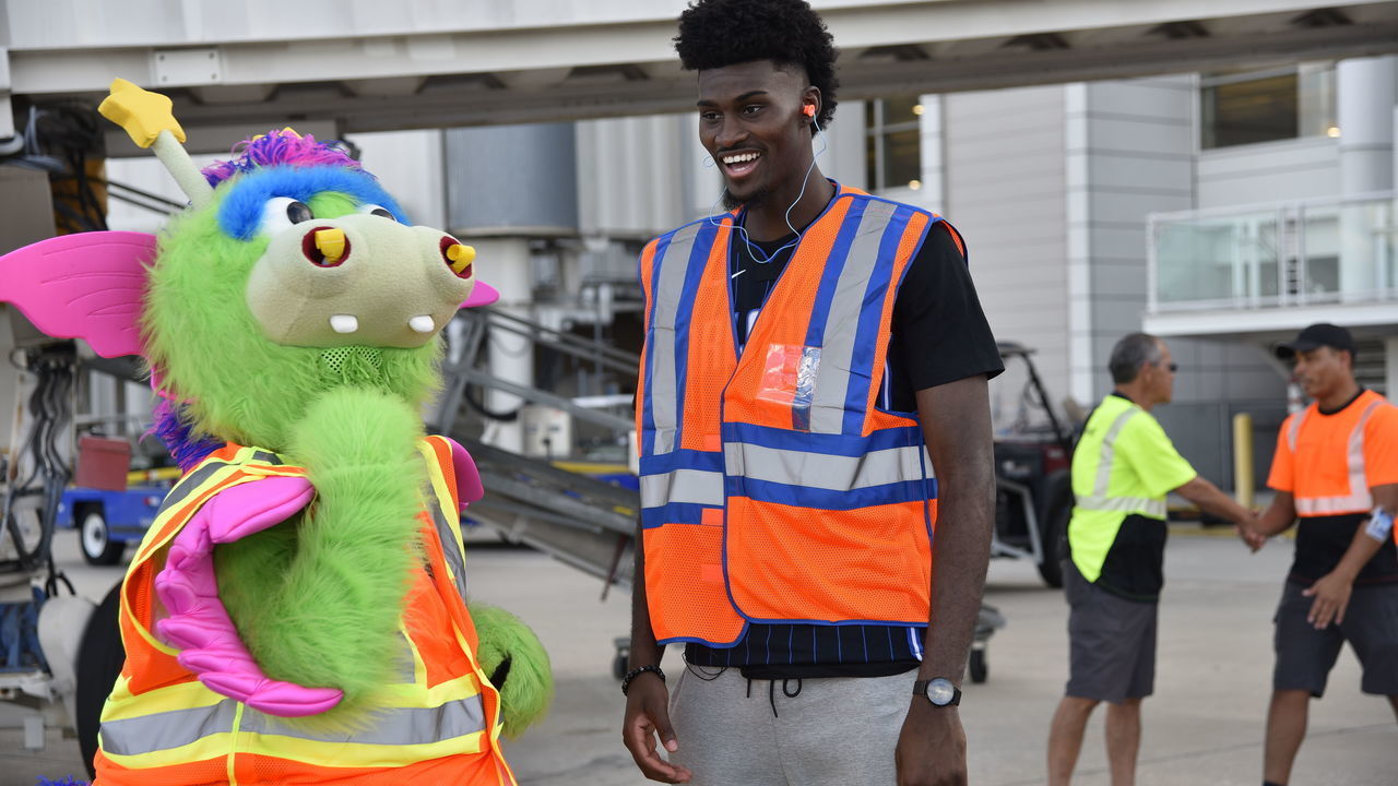 ORLANDO, FL - NOVEMBER 12: Jonathan Isaac #1 and Stuff the Magic Dragon of the Orlando Magic participate during Southwest Airlines Trading Places event on November 12, 2019 at Orlando International Airport in Orlando, Florida. Mandatory Copyright Notice: Copyright 2019 NBAE
