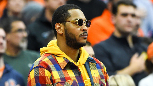 SYRACUSE, NY - NOVEMBER 06: Syracuse Orange basketball alum Carmelo Anthony looks on during the National Anthem prior to the game between the Virginia Cavaliers and the Syracuse Orange at the Carrier Dome on November 6, 2019 in Syracuse, New York. Virginia defeated Syracuse 48-34.