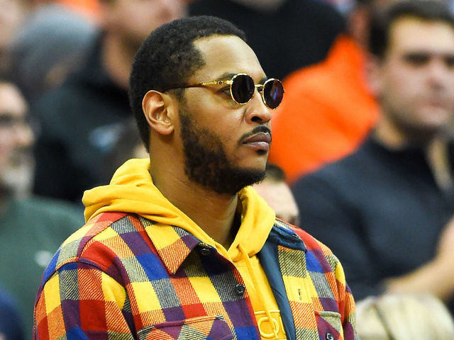 SYRACUSE, NY - NOVEMBER 06: Syracuse Orange basketball alum Carmelo Anthony looks on during the National Anthem prior to the game between the Virginia Cavaliers and the Syracuse Orange at the Carrier Dome on November 6, 2019 in Syracuse, New York. Virginia defeated Syracuse 48-34.