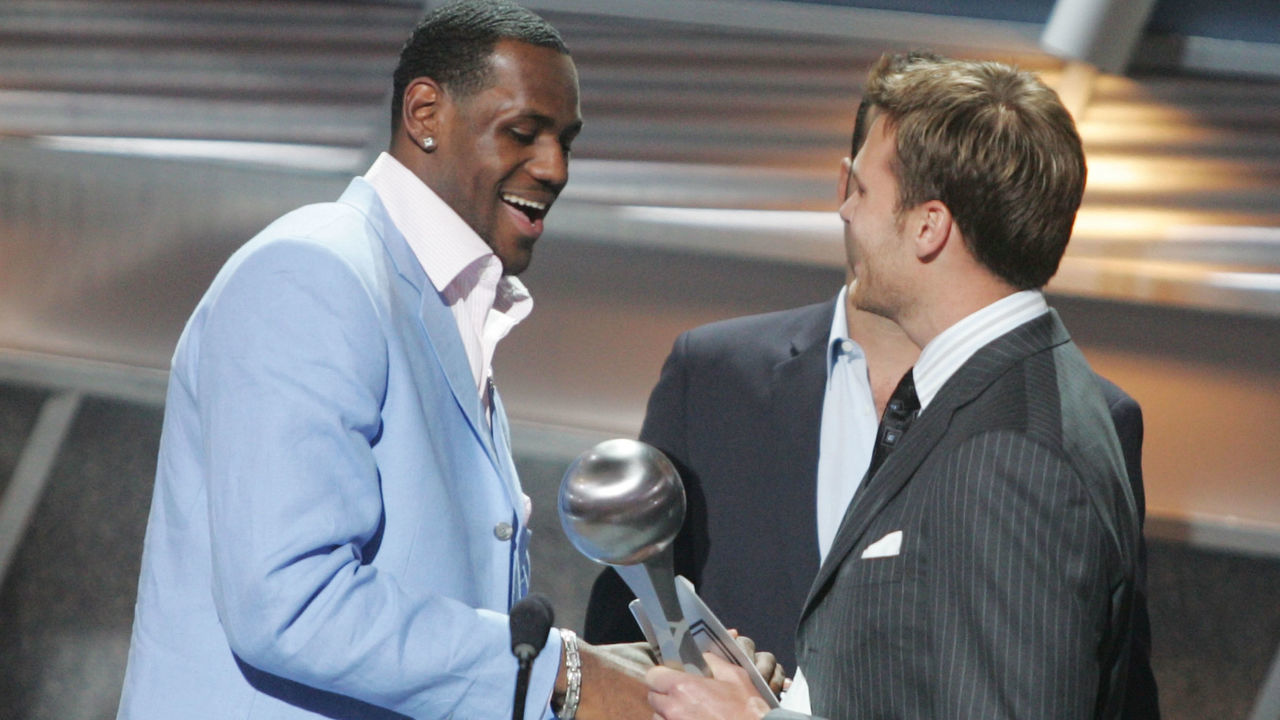 HOLLYWOOD - JULY 14: Winner for Best Breakthrough athlete, basketball player LeBron James is greeted on stage by quarterback Tom Brady at the 12th Annual ESPY Awards held at the Kodak Theatre on July 14, 2004 in Hollywood, California. This year's ESPY's will air Sunday, July 16th on ESPN beginning 9 PM EST/6 PM EST.