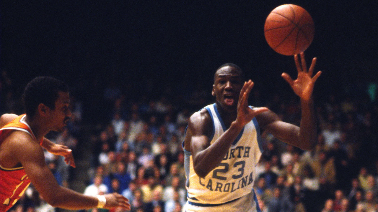 CHAPEL HILL, NC - 1983: Michael Jordan #23 of the North Carolina Tar Heels receives the pass against the Clemson Tigers circa 1983 in Chapel Hill, North Carolina. Mandatory Copyright Notice: Copyright 1983 NBAE