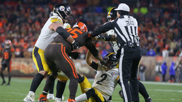 CLEVELAND, OH - NOVEMBER 14: Cleveland Browns defensive end Myles Garrett (95) pulls the face mask of Pittsburgh Steelers quarterback Mason Rudolph (2) as Pittsburgh Steelers offensive guard David DeCastro (66), Pittsburgh Steelers offensive tackle Matt Feiler (71) and referee Clete Blakeman (34) come to Rudolphs aid during the fourth quarter of the National Football League game between the Pittsburgh Steelers and Cleveland Browns on November 14, 2019, at FirstEnergy Stadium in Cleveland, OH.