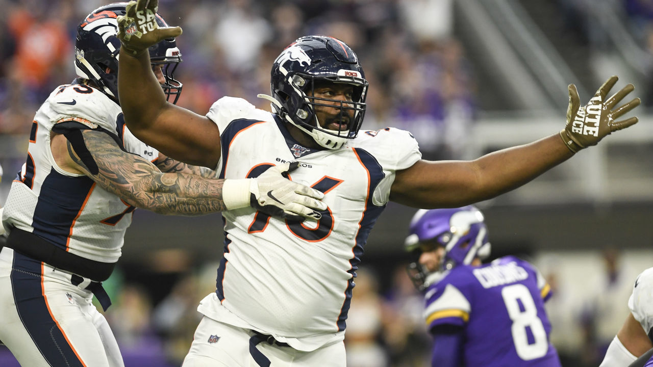 MINNEAPOLIS, MN - NOVEMBER 17: Shelby Harris (96) of the Denver Broncos celebrates his sack and forced fumble on Kirk Cousins (8) of the Minnesota Vikings with teammate Derek Wolfe (95) during the second quarter on Sunday, November 17, 2019.