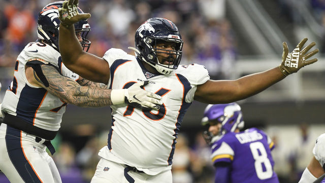 MINNEAPOLIS, MN - NOVEMBER 17: Shelby Harris (96) of the Denver Broncos celebrates his sack and forced fumble on Kirk Cousins (8) of the Minnesota Vikings with teammate Derek Wolfe (95) during the second quarter on Sunday, November 17, 2019.