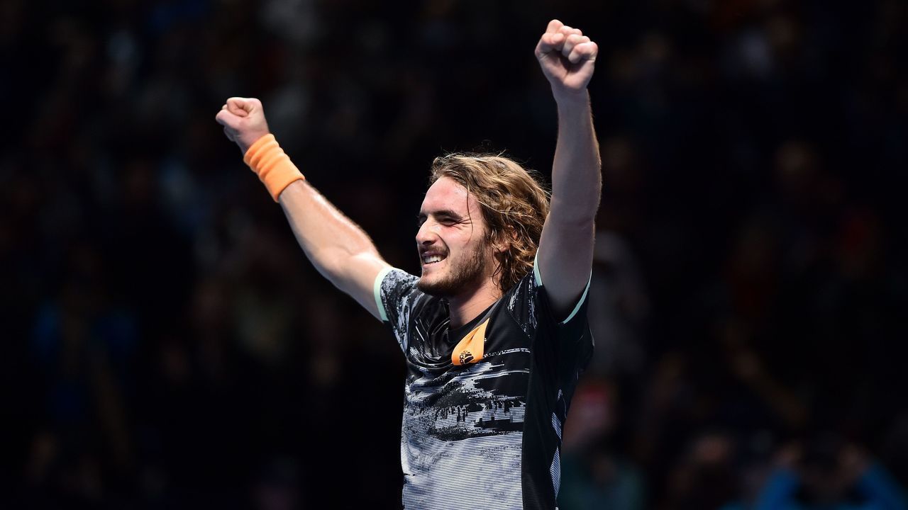 Greece's Stefanos Tsitsipas celebrates winning against Austria's Dominic Thiem during the men's singles final match on day eight of the ATP World Tour Finals tennis tournament at the O2 Arena in London on November 17, 2019. - Tsitsipas beat Austria's Dominic Thiem to win the match 6-7, 6-2, 7-6.