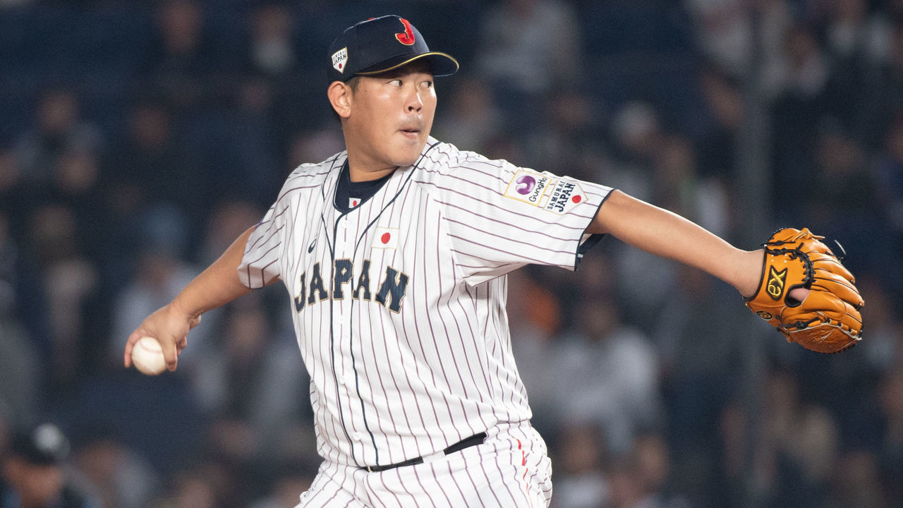 CHIBA, JAPAN - NOVEMBER 11: Shun Yamaguchi #18 of Team Japan pitching during the WBSC Premier 12 Super Round game between Japan and Australia at the Zozo Marine Stadium on November 11, 2019 in Chiba, Japan.