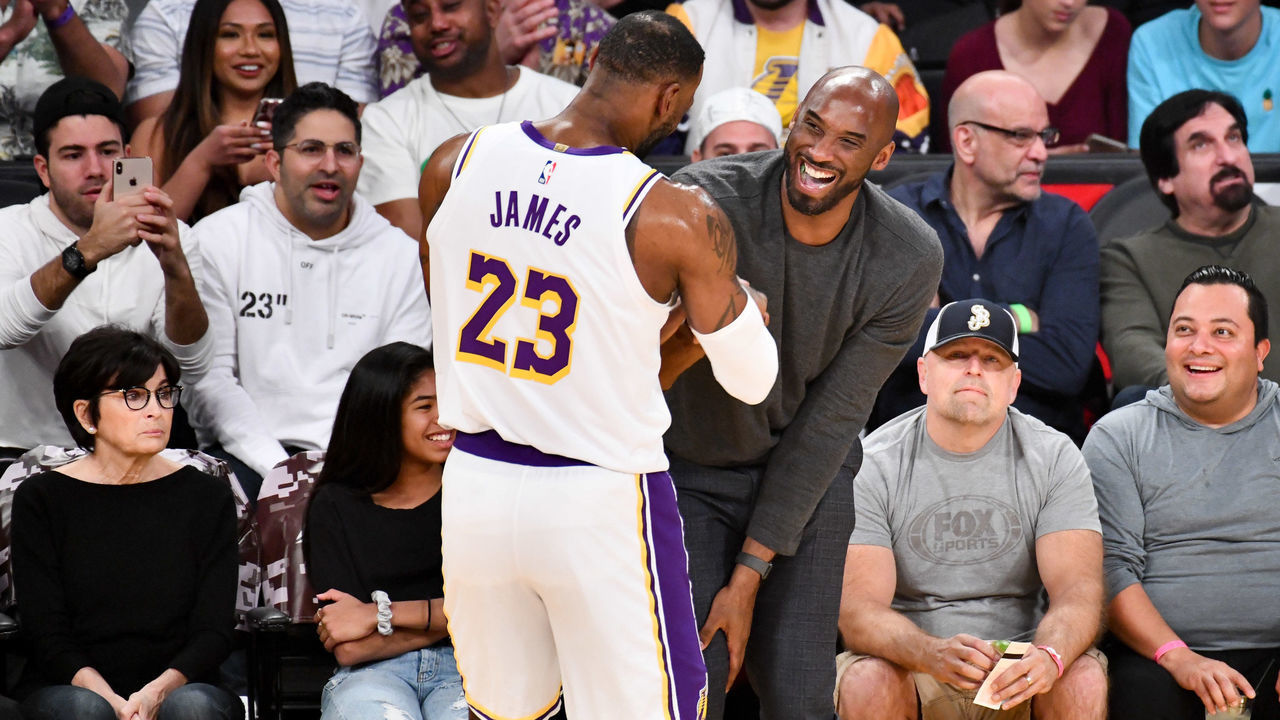 LOS ANGELES, CALIFORNIA - NOVEMBER 17: Kobe Bryant embraces LeBron James during a basketball game between the Los Angeles Lakers and the Atlanta Hawks at Staples Center on November 17, 2019 in Los Angeles, California.