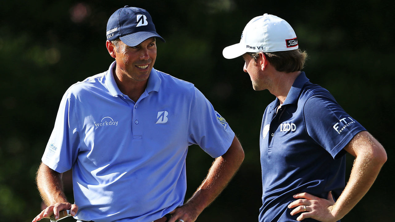 HONOLULU, HI - JANUARY 16: Matt Kuchar (L) talks to Webb Simpson on the 15th green during the second round of the Sony Open In Hawaii at Waialae Country Club on January 16, 2015 in Honolulu, Hawaii.