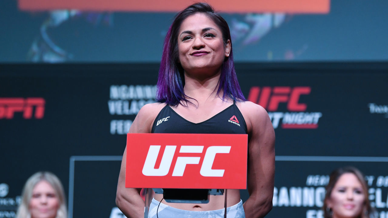 PHOENIX, ARIZONA - FEBRUARY 16: Cynthia Calvillo poses on the scale during the UFC Fight Night weigh-in at Comerica Theatre on February 16, 2019 in the Phoenix, Arizona.