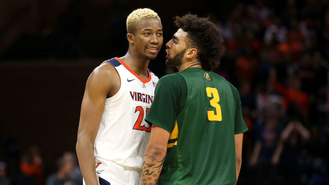CHARLOTTESVILLE, VA - NOVEMBER 19: Mamadi Diakite #25 of the Virginia Cavaliers and Anthony Lamb #3 of the Vermont Catamounts talk in the second half during a game at John Paul Jones Arena on November 19, 2019 in Charlottesville, Virginia.