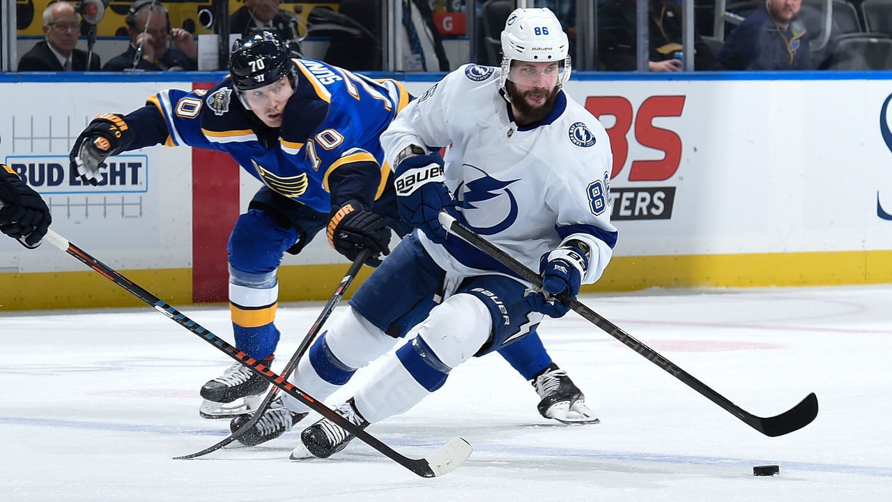 ST. LOUIS, MO - NOVEMBER 19: Oskar Sundqvist #70 of the St. Louis Blues pressures Nikita Kucherov #86 of the Tampa Bay Lightning at Enterprise Center on November 19, 2019 in St. Louis, Missouri.
