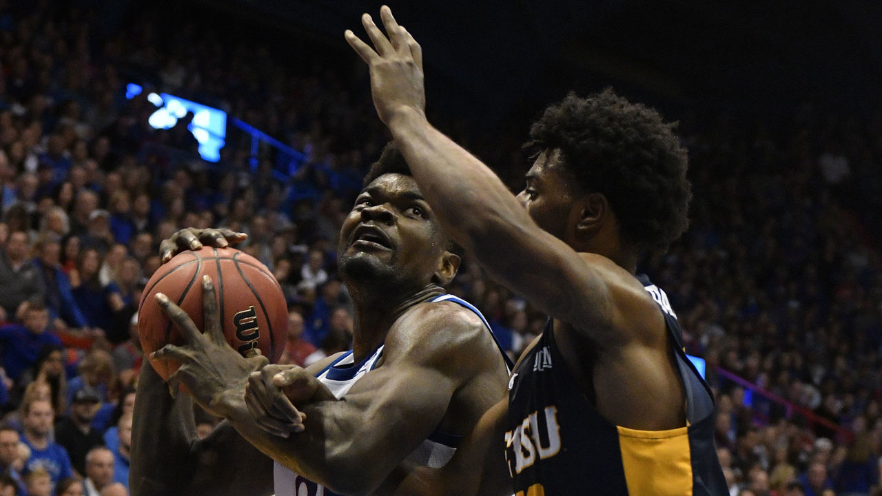 LAWRENCE, KANSAS - NOVEMBER 19: Udoka Azubuike #35 of the Kansas Jayhawks makes a move towards the basket against Vonnie Patterson #23 of the East Tennessee State Buccaneers during the first half at Allen Fieldhouse on November 19, 2019 in Lawrence, Kansas.
