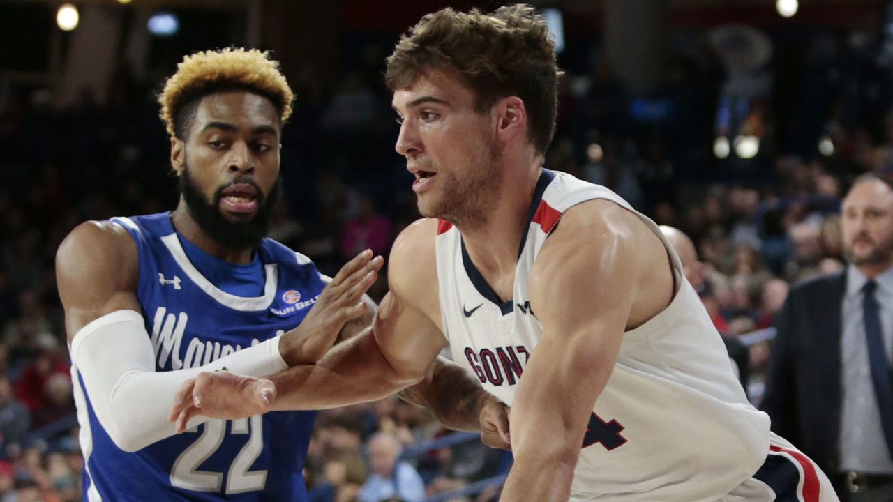 SPOKANE, WASHINGTON - NOVEMBER 19: Corey Kispert #24 of the Gonzaga Bulldogs drives against TiAndre Jackson-Young #22 of the UT Arlington Mavericks in the first half at McCarthey Athletic Center on November 19, 2019 in Spokane, Washington.