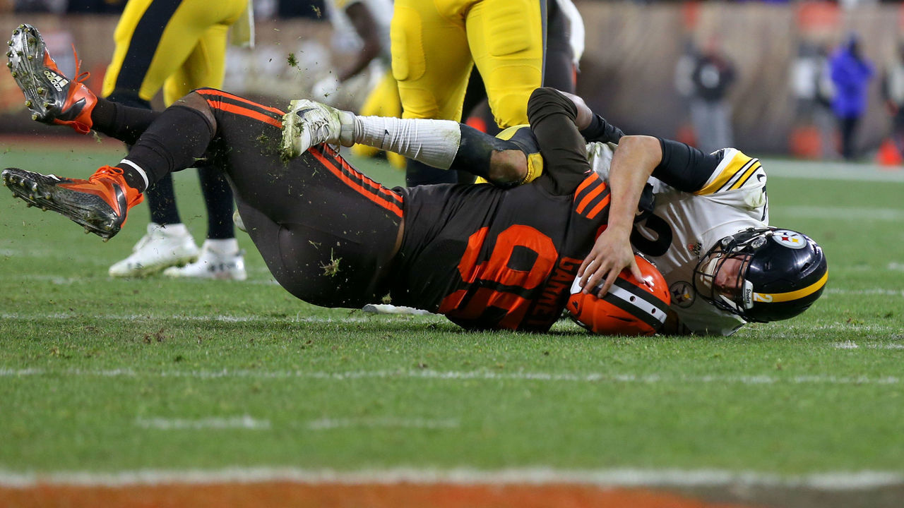 CLEVELAND, OH - NOVEMBER 14: Cleveland Browns defensive end Myles Garrett (95) takes Pittsburgh Steelers quarterback Mason Rudolph (2) to the ground during the fourth quarter of the National Football League game between the Pittsburgh Steelers and Cleveland Browns on November 14, 2019, at FirstEnergy Stadium in Cleveland, OH.