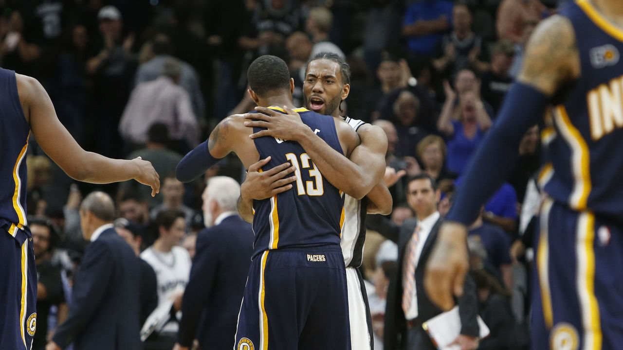 SAN ANTONIO,TX - MARCH 1: Kawhi Leonard #2 of the San Antonio Spurs hugs Paul George #13 of the Indiana Pacers at the end of the game at AT&T Center on March 1, 2017 in San Antonio, Texas. NOTE TO USER: User expressly acknowledges and agrees that , by downloading and or using this photograph, User is consenting to the terms and conditions of the Getty Images License Agreement.