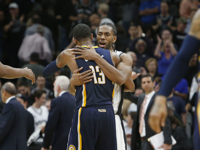 SAN ANTONIO,TX - MARCH 1: Kawhi Leonard #2 of the San Antonio Spurs hugs Paul George #13 of the Indiana Pacers at the end of the game at AT&T Center on March 1, 2017 in San Antonio, Texas. NOTE TO USER: User expressly acknowledges and agrees that , by downloading and or using this photograph, User is consenting to the terms and conditions of the Getty Images License Agreement.