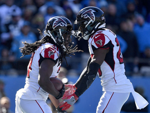 CHARLOTTE, NORTH CAROLINA - NOVEMBER 17: Desmond Trufant #21 celebrates with Damontae Kazee #27 of the Atlanta Falcons after intercepting a pass against the Carolina Panthers during the second quarter of their game at Bank of America Stadium on November 17, 2019 in Charlotte, North Carolina.