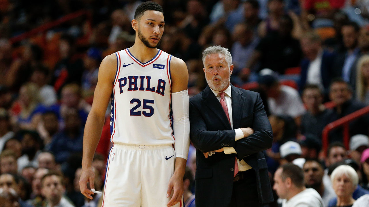 MIAMI, FL - NOVEMBER 12: Head coach Brett Brown of the Philadelphia 76ers talks with Ben Simmons #25 against the Miami Heat during the second half at American Airlines Arena on November 12, 2018 in Miami, Florida.