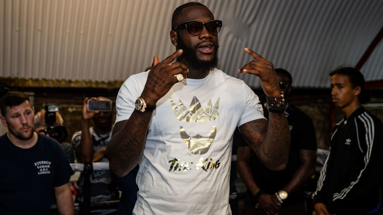Deontay Wilder talking with young boxers during the photocall at Fitzroy Lodge Gym, London.