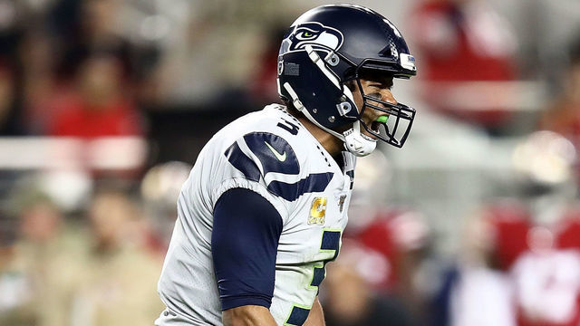 SANTA CLARA, CALIFORNIA - NOVEMBER 11: Quarterback Russell Wilson #3 of the Seattle Seahawks celebrates the touchdown by running back Chris Carson #32 in the third quarter against the San Francisco 49ers at Levi's Stadium on November 11, 2019 in Santa Clara, California.