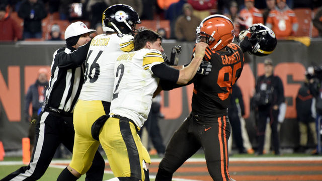 CLEVELAND, OHIO - NOVEMBER 14: Quarterback Mason Rudolph #2 of the Pittsburgh Steelers fights with defensive end Myles Garrett #95 of the Cleveland Browns during the second half at FirstEnergy Stadium on November 14, 2019 in Cleveland, Ohio. The Browns defeated the Steelers 21-7.