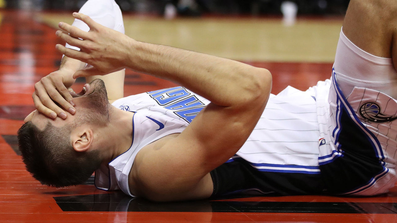 TORONTO, ON- NOVEMBER 20 - Orlando Magic center Nikola Vucevic (9) injures his ankle as the Toronto Raptors beat the Orlando Magic 113-97 at Scotiabank Arena in Toronto. November 20, 2019. (Steve Russell/Toronto Star via Getty Images)