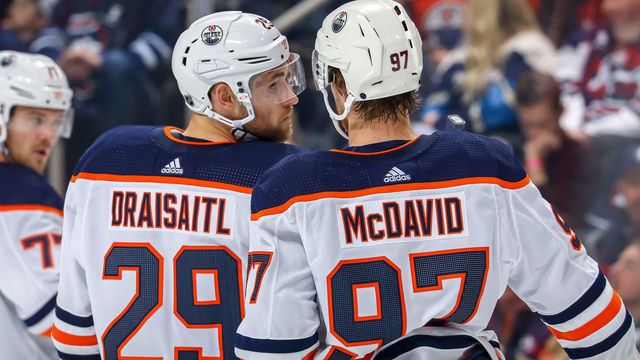 WINNIPEG, MB - OCTOBER 20: Leon Draisaitl #29 and Connor McDavid #97 of the Edmonton Oilers discuss strategy during a first period stoppage in play against the Winnipeg Jets at the Bell MTS Place on October 20, 2019 in Winnipeg, Manitoba, Canada.