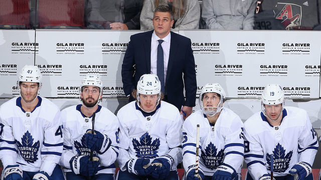 GLENDALE, ARIZONA - NOVEMBER 21: Head coach Sheldon Keefe of the Toronto Maple Leafs looks up from the bench during the first period of the NHL game against the Arizona Coyotes at Gila River Arena on November 21, 2019 in Glendale, Arizona.