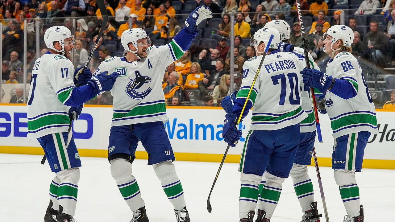 NASHVILLE, TN - NOVEMBER 21: The Vancouver Canucks celebrate a goal against the Nashville Predators at Bridgestone Arena on November 21, 2019 in Nashville, Tennessee.