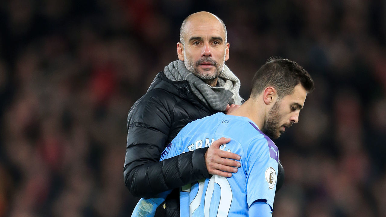 LIVERPOOL, ENGLAND - NOVEMBER 10: Man City manager Pep Guardiola consoles Bernardo Silva of Man City after the Premier League match between Liverpool FC and Manchester City at Anfield on November 10, 2019 in Liverpool, United Kingdom.